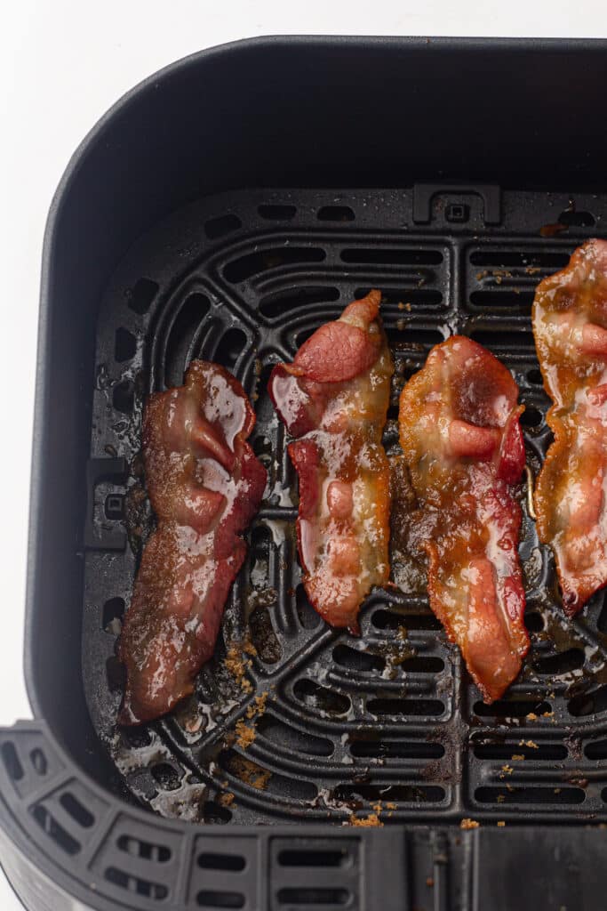Air fried candied bacon in an air fryer tray