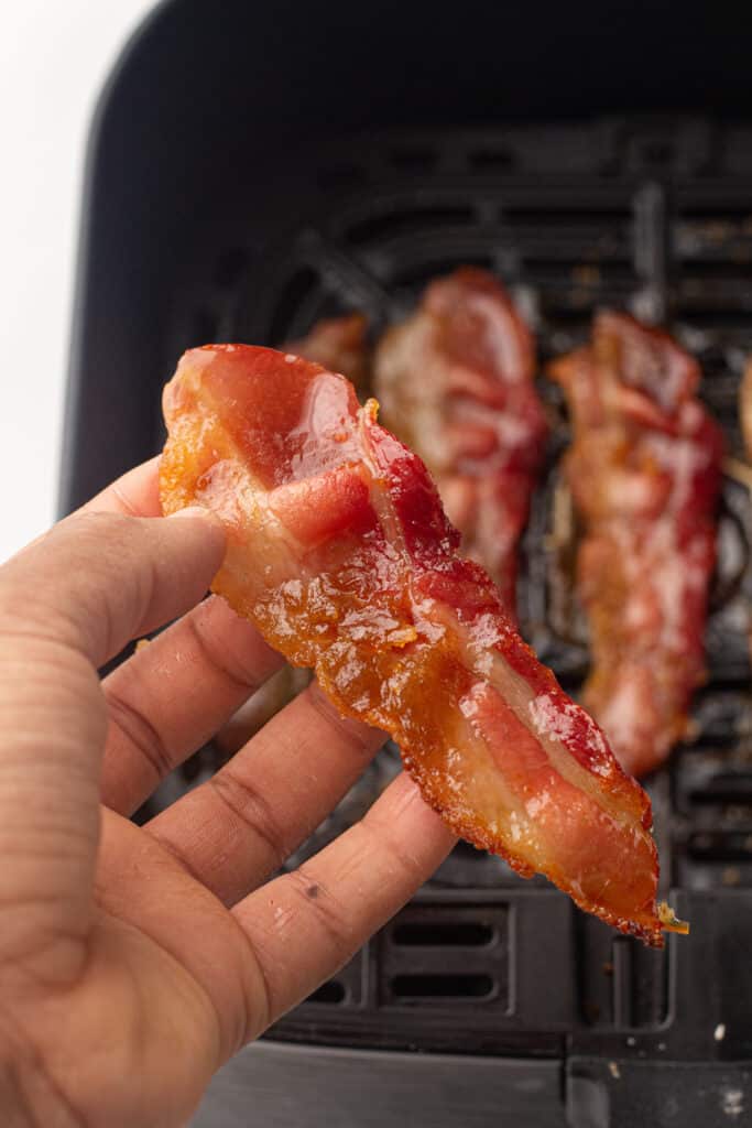 Air fried candied bacon in an air fryer tray