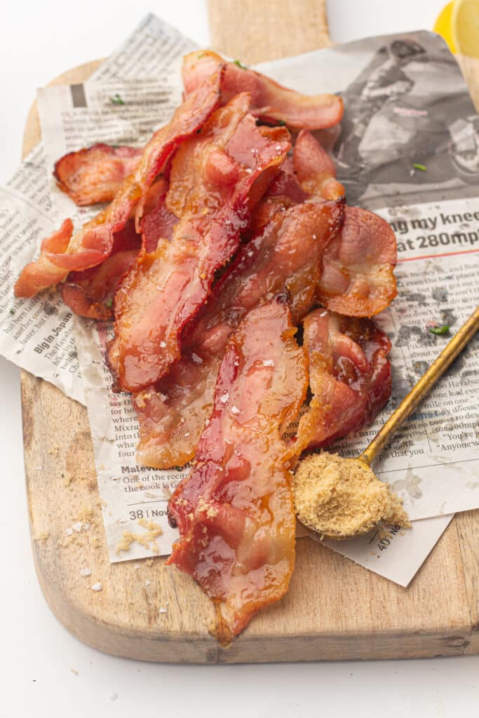 Air fried candied bacon on a chopping board