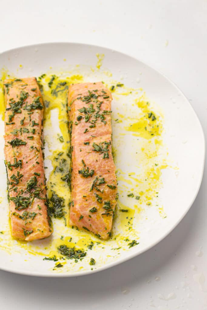 Salmon on a plate marinated with herbs 
