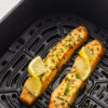 Salmon in the air fryer with lemon garnish