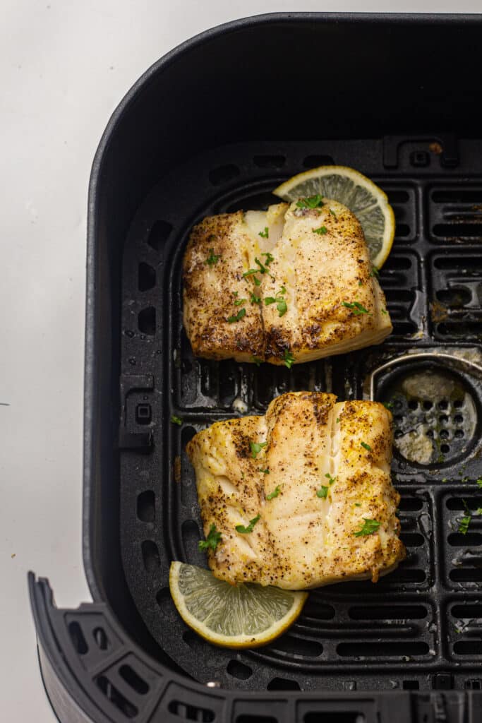 Cod in the air fryer with lemon garnish