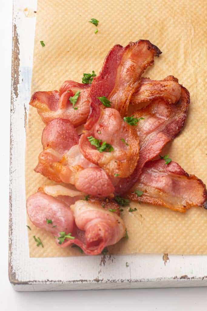 Air fryer bacon on a chopping board 