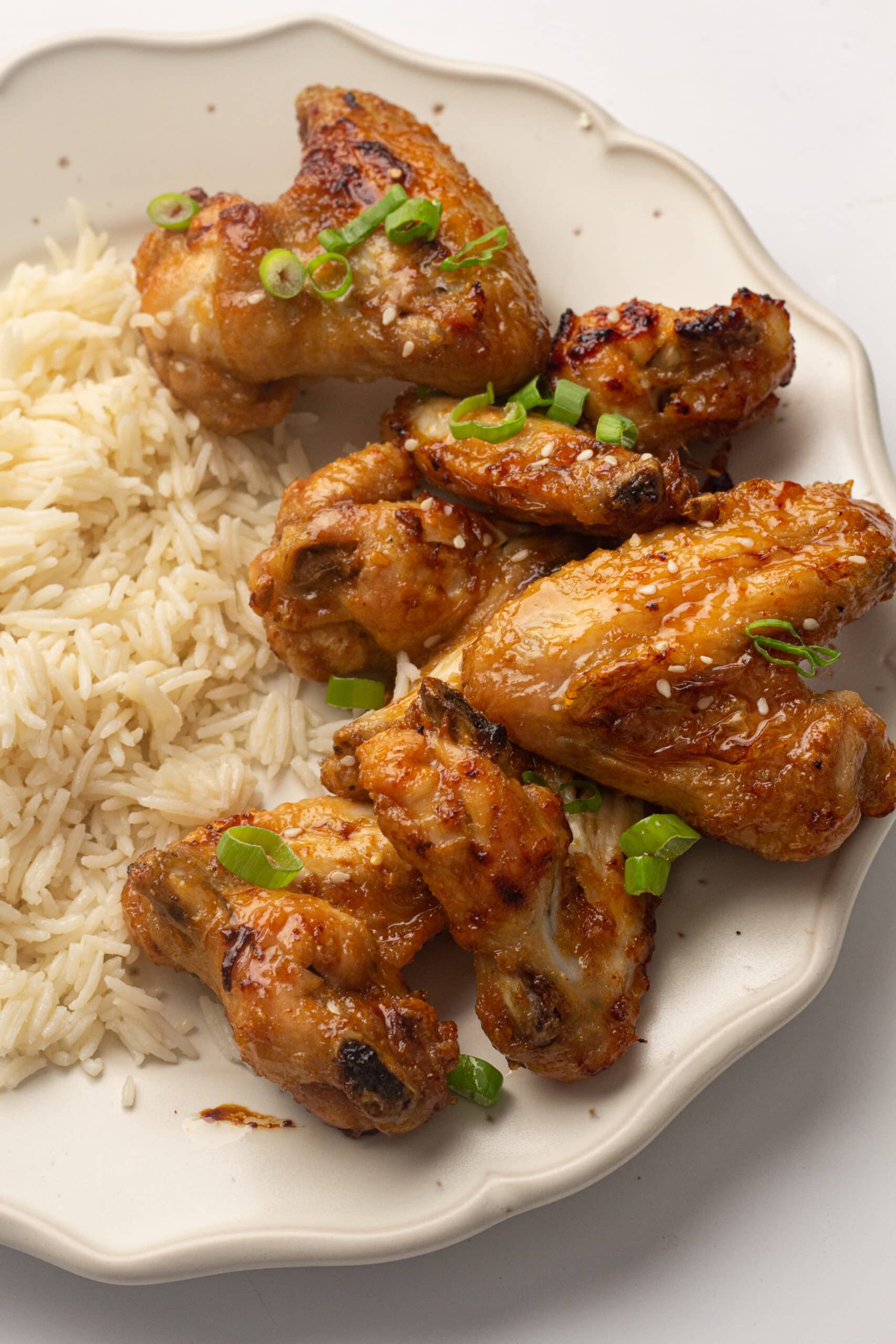 Air Fryer honey Soy chicken wings on a plate with rice