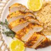Air Fryer Chicken Breast on a plate garnished with lemon