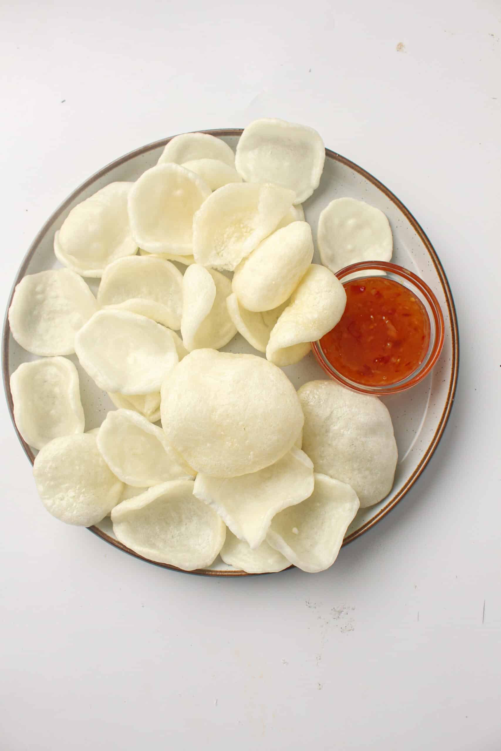 Air Fryer Prawn Crackers on a plate with sweet chilli sauce