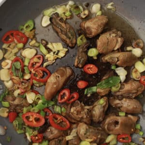 Ginger and Green Onion Stir fried Oysters in a pan