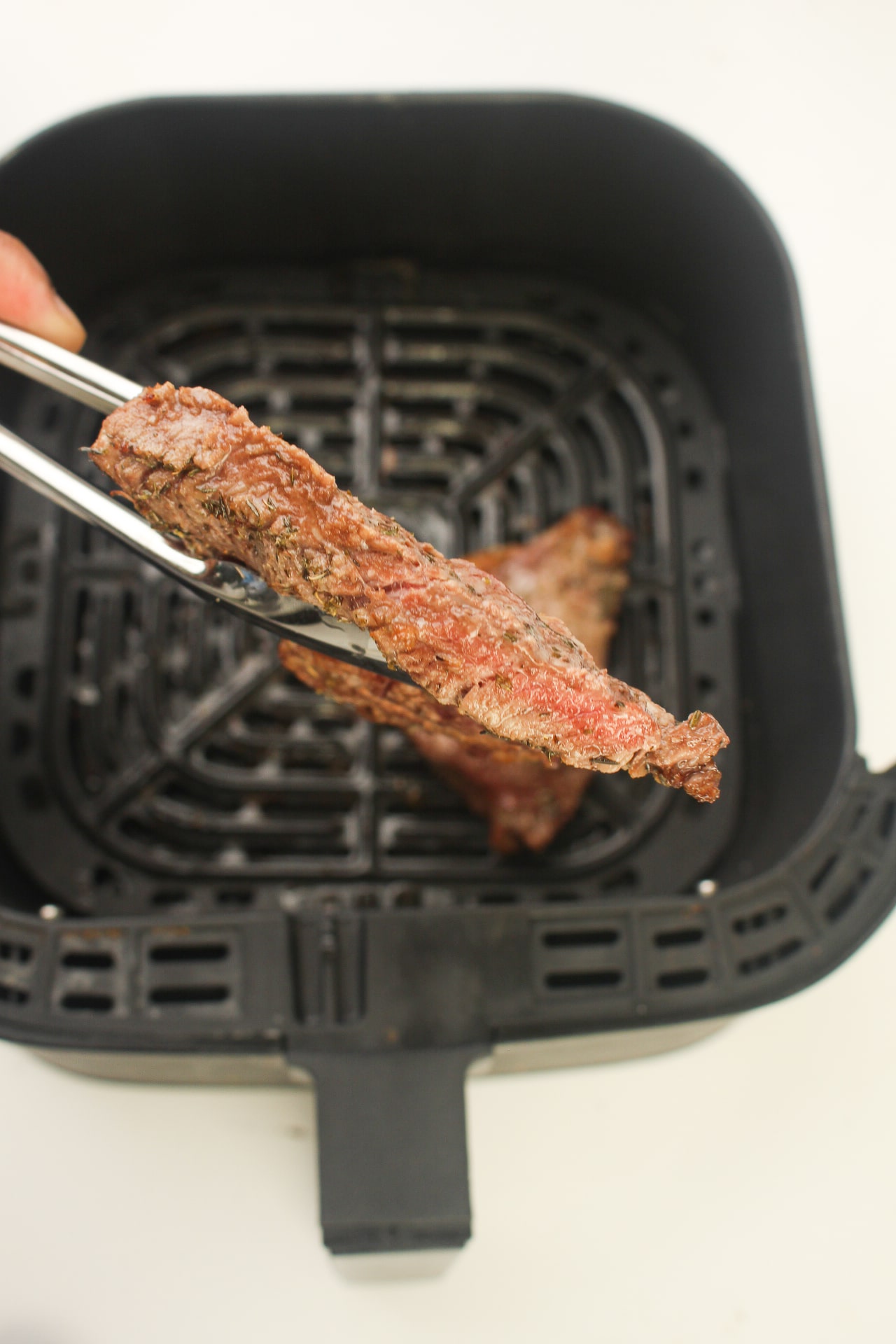Air fryer marinated steak sliced in half