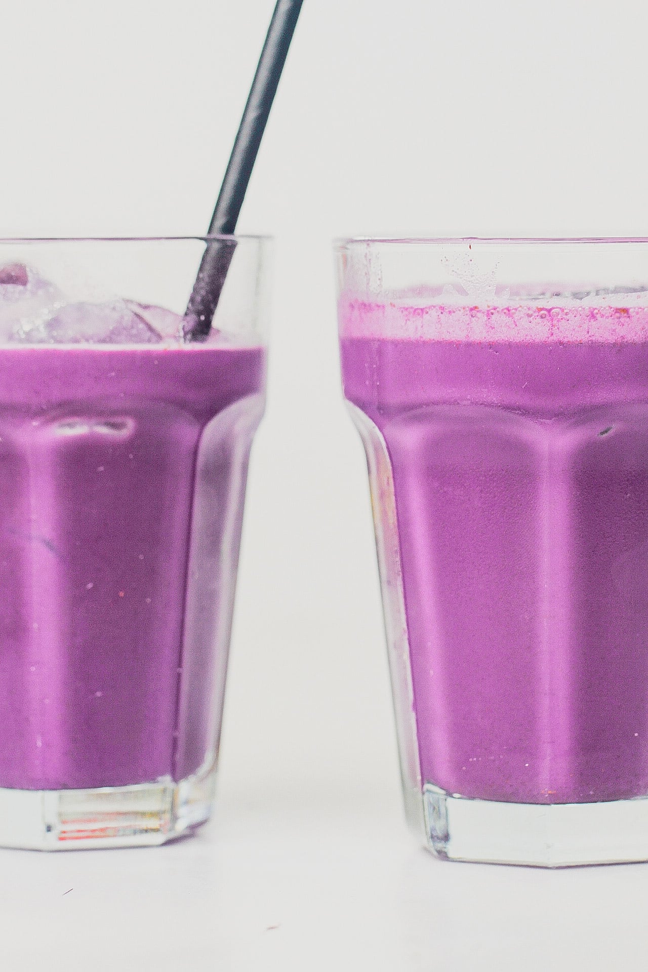 Ube Horchata in glasses and a black straw