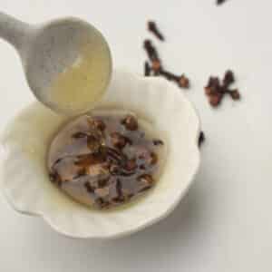 clove honey in a small bowl