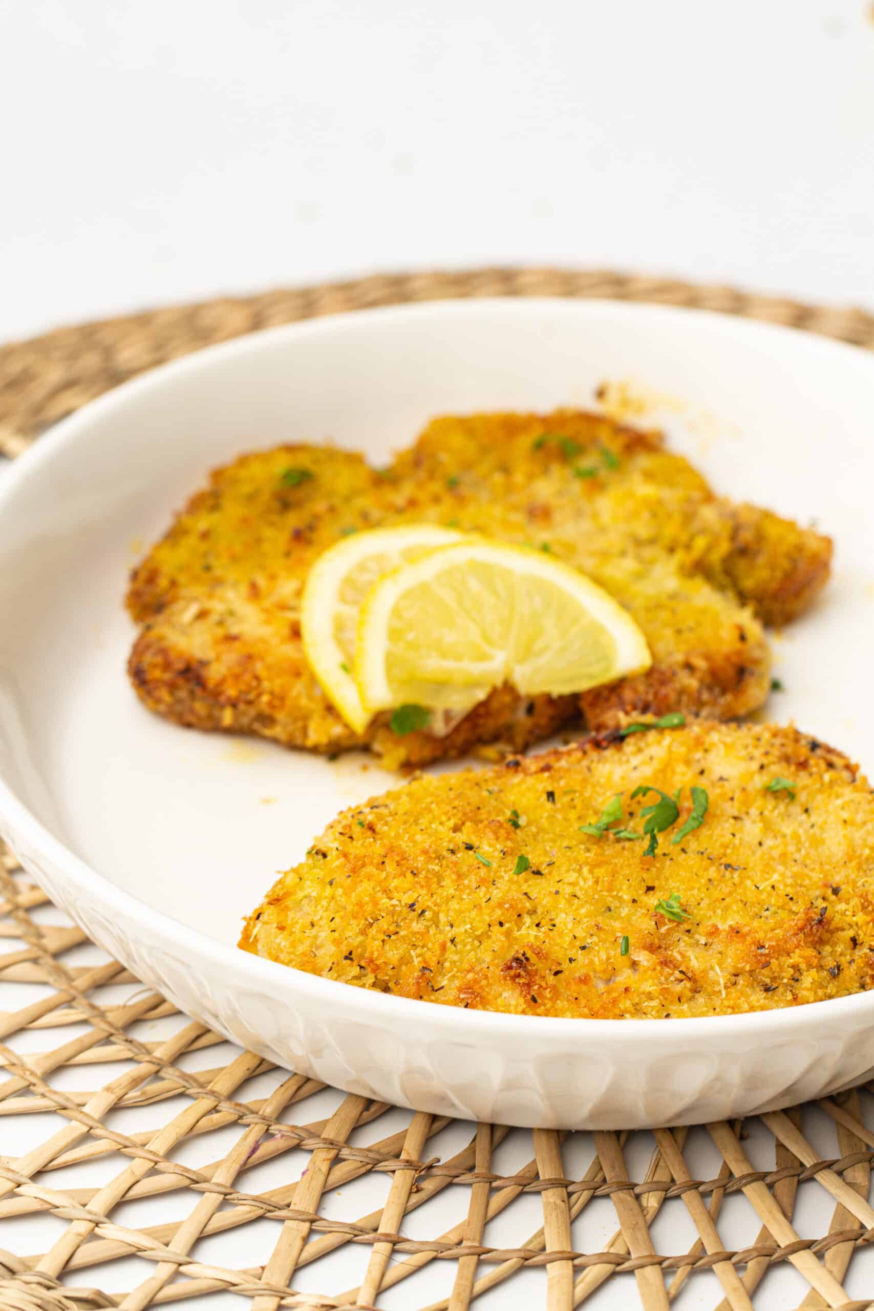 Air Fryer Breaded Pork Chops on a plate and dinner table mat