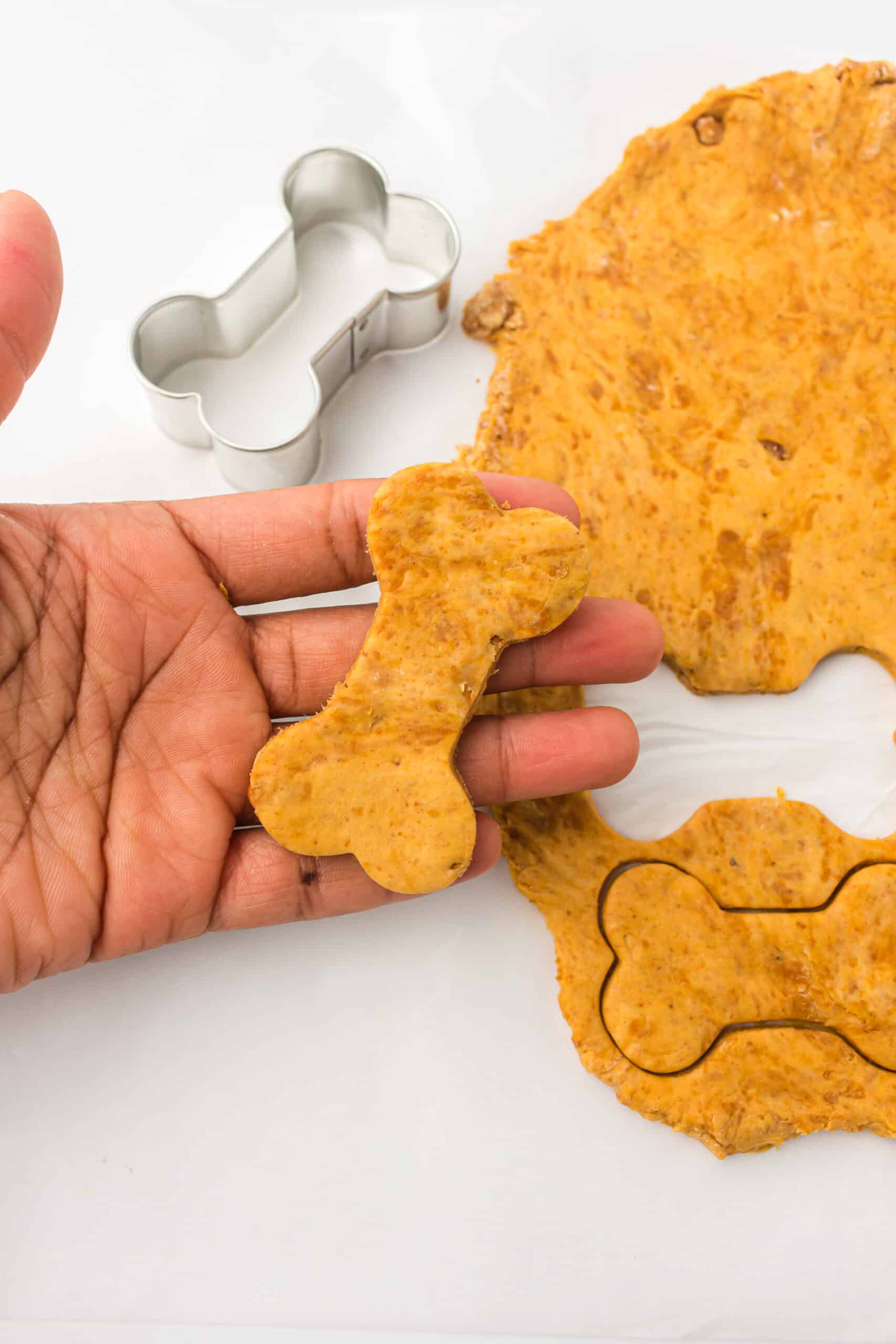 Cut out shapes using cookie cutters or use your hands to form small bite sized pieces of dough .
