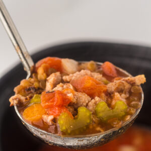 Slow Cooker Lentil and Sausage Soup in a ladle