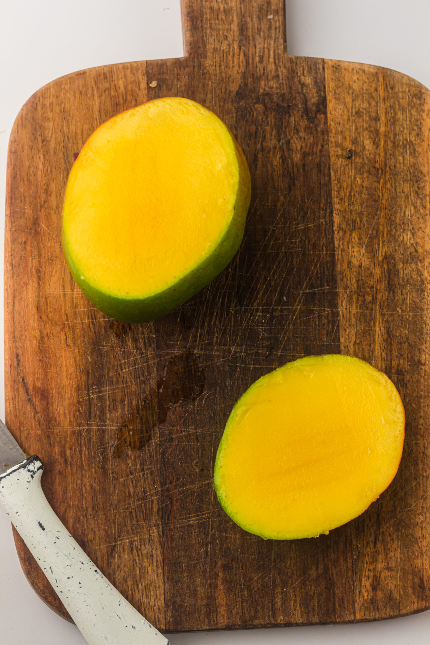 Peeling the mangoes