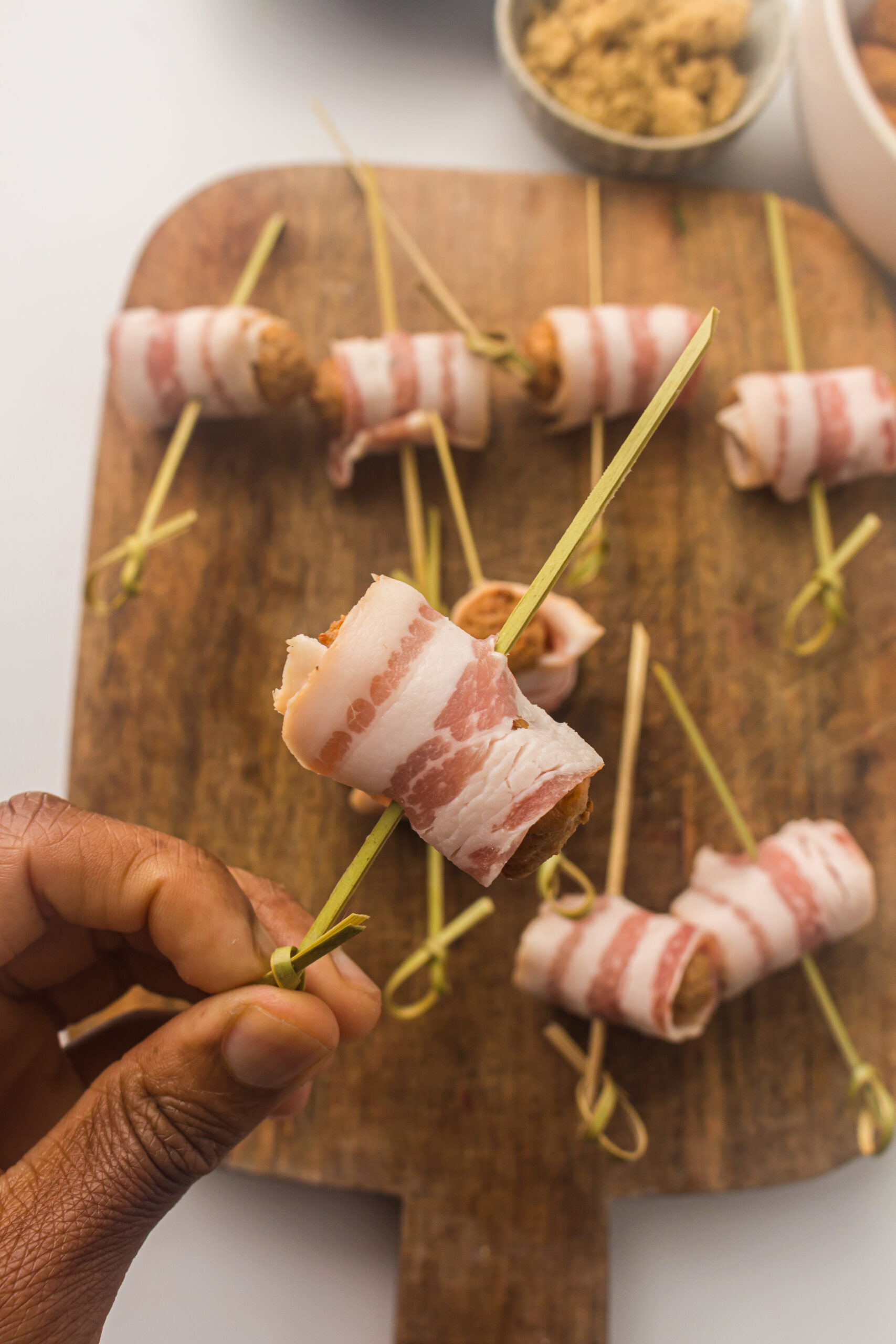 wrapping bacon around the smokies 