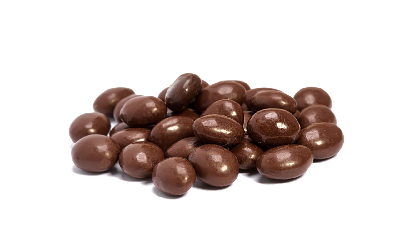 chocolate almonds in heap isolated on white